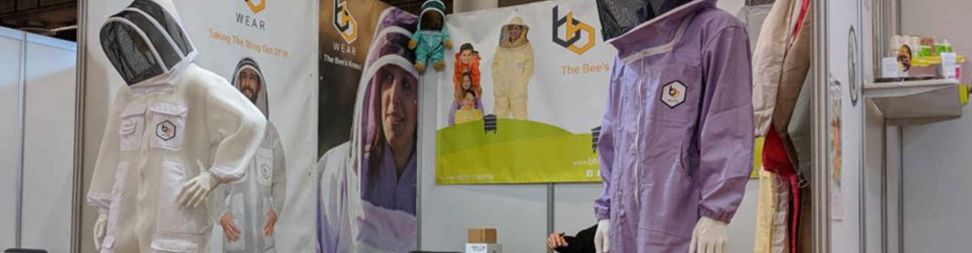 trade stand with mannequins in bee suits 
