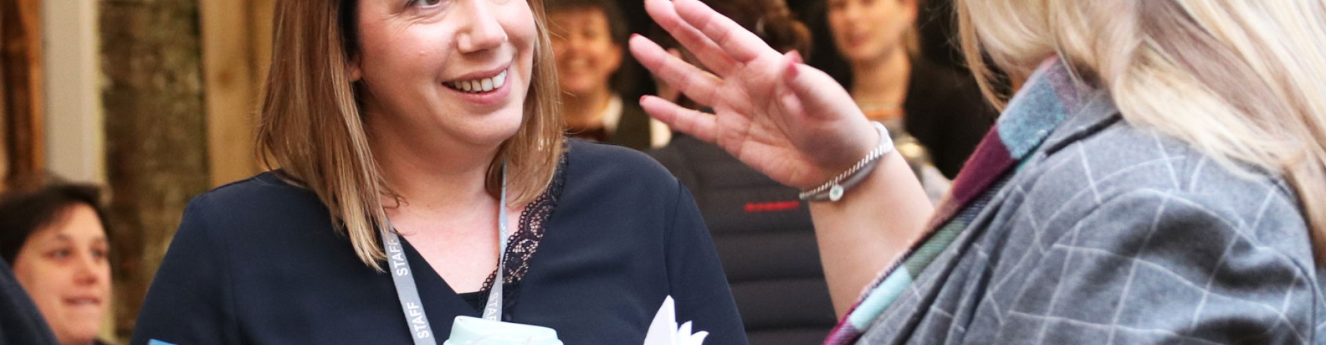women talking in a business networking setting