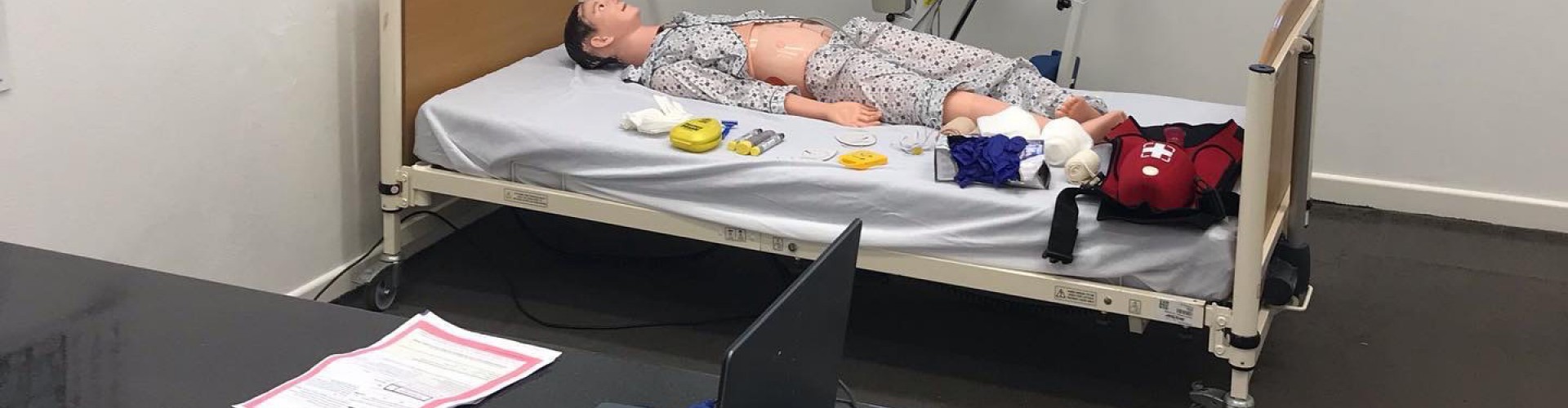office with medical dummy on bed