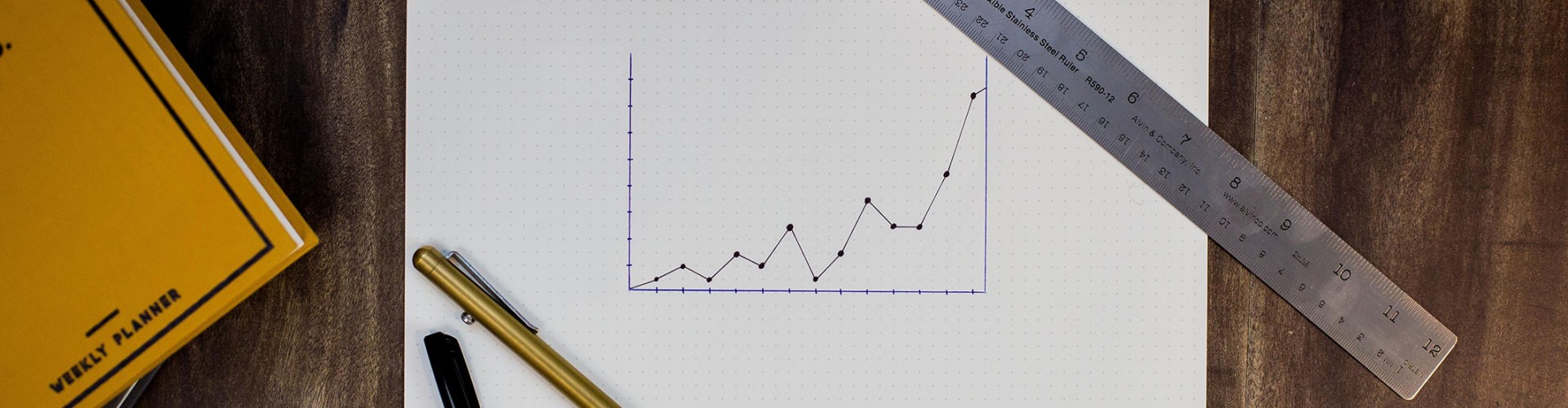neatly drawn graph with ruler and pens