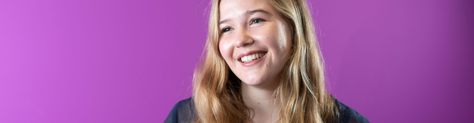 young woman apprentice purple background