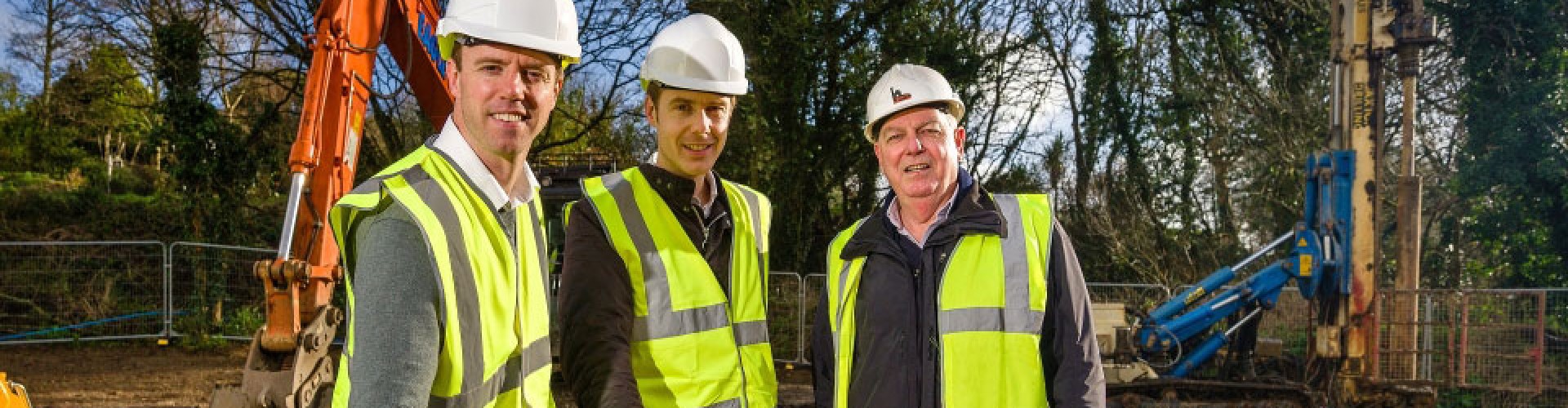 3 men in high viz building gear