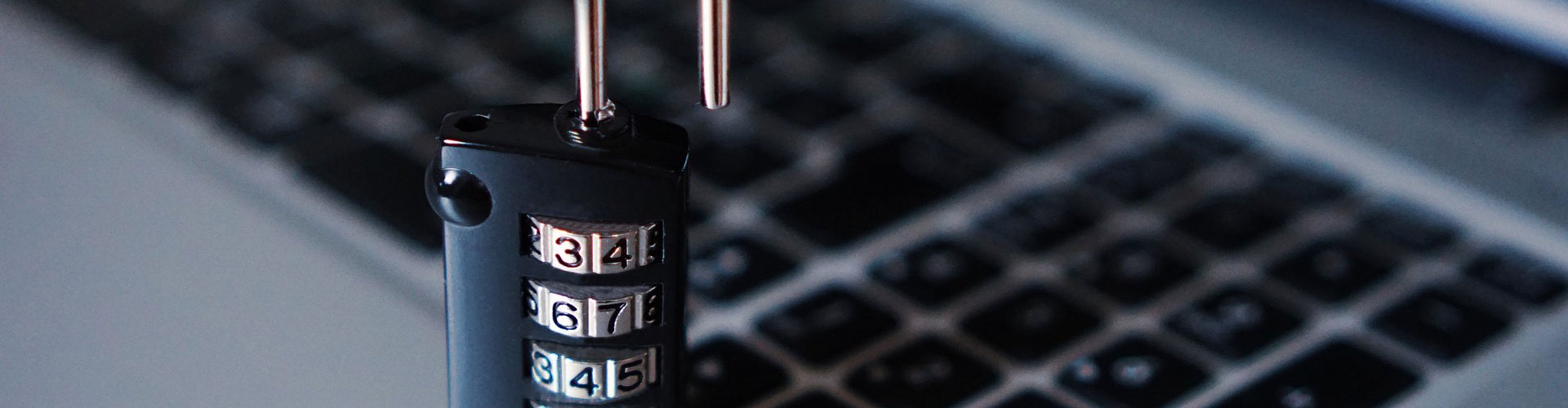 laptop keyboard with padlock - demonstrating cyber security