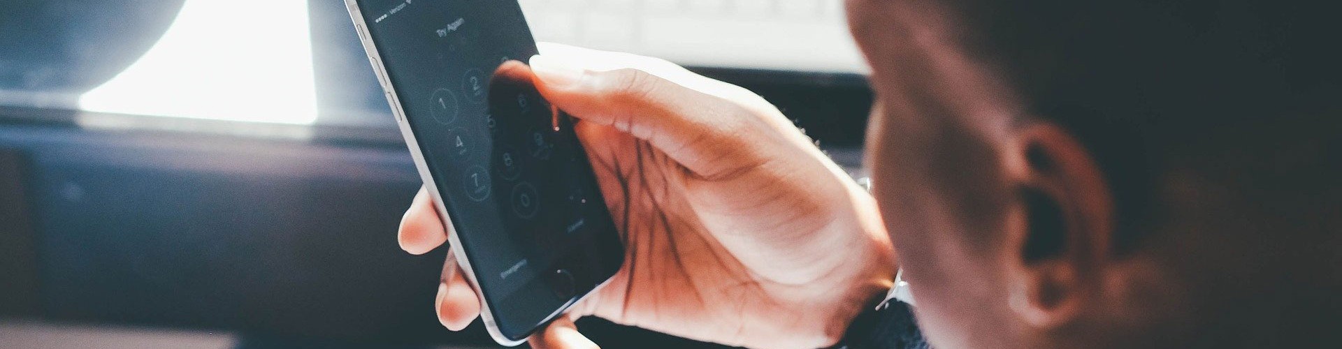 young man looking at smartphone