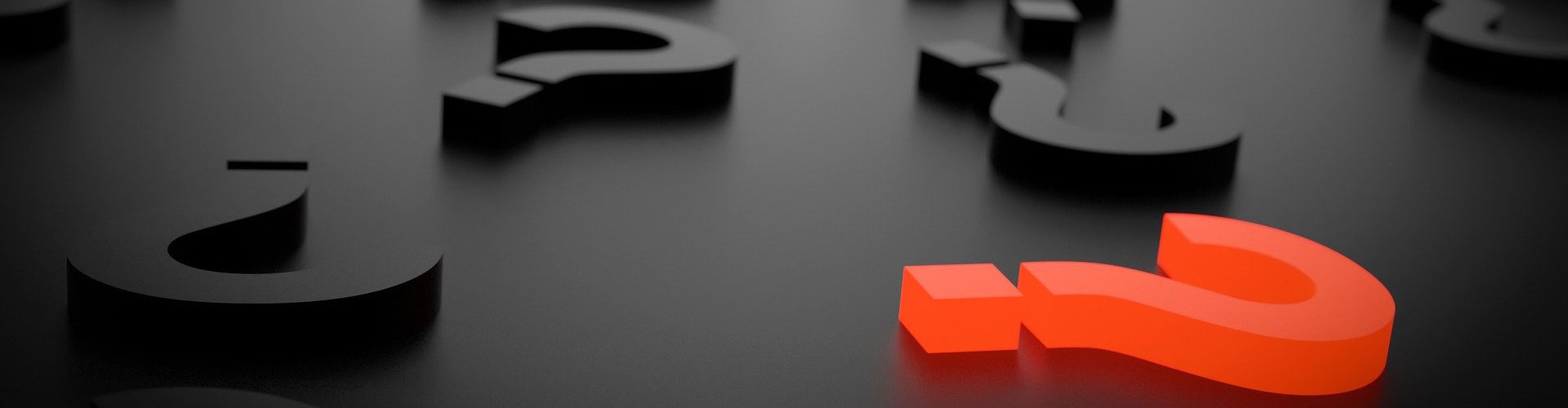 3D black question marks on black background. one red question mark