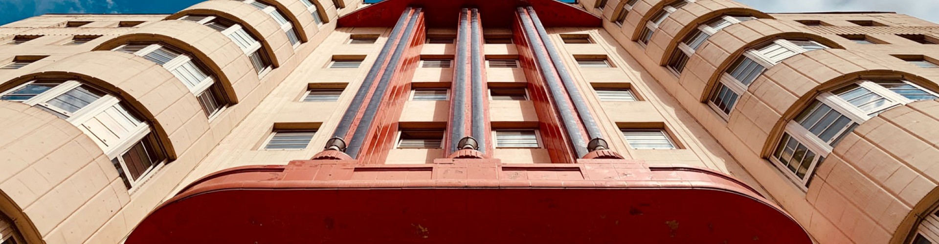 low perspective on deco building with blue sky