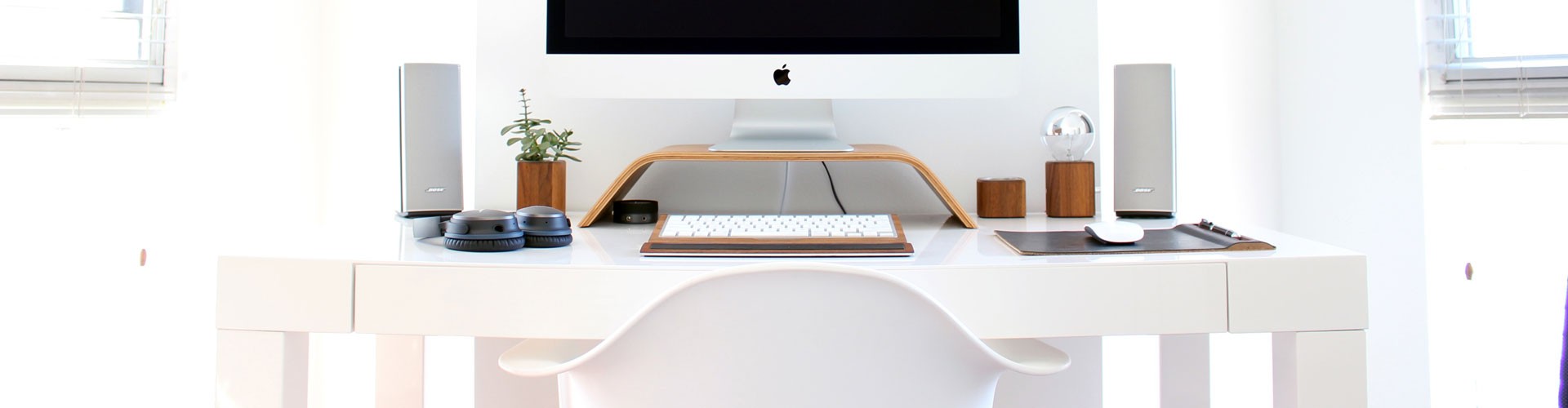 mac computer in white minimalist home office