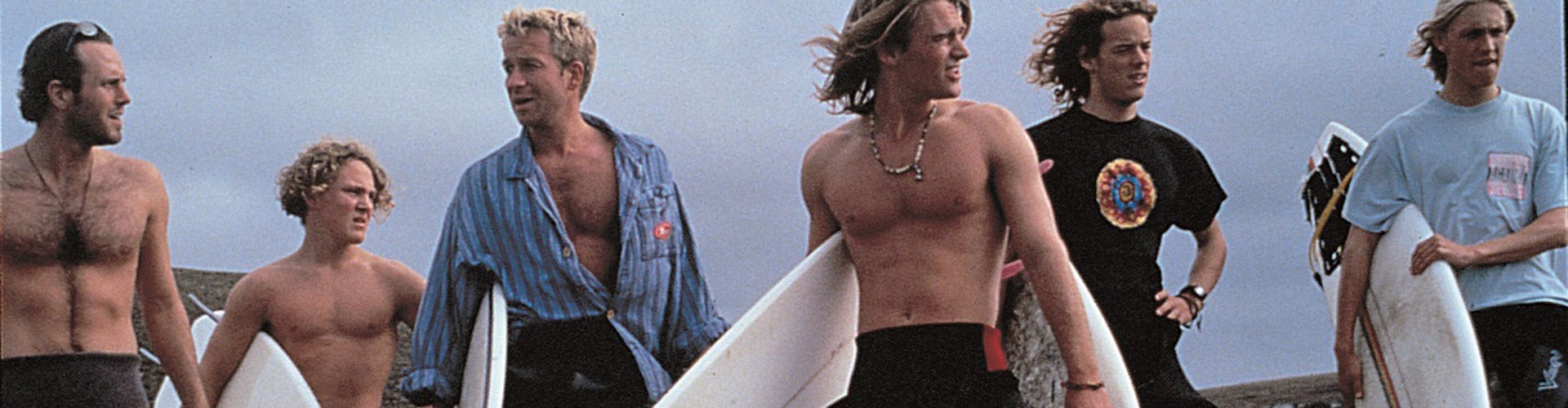still from film blue juice - surfers holding boards