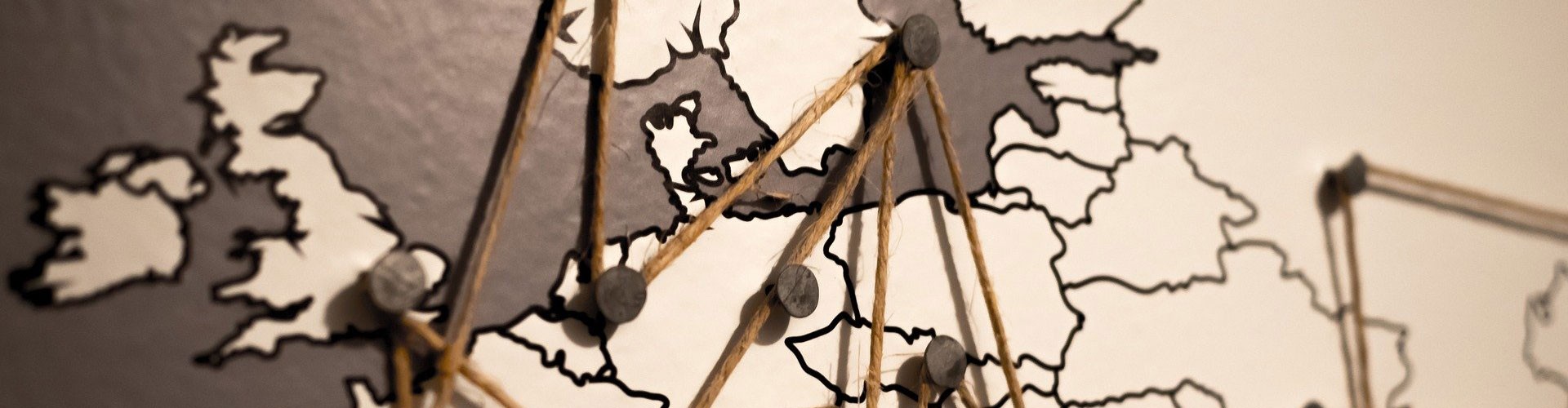 map of Northern Europe with pins and string