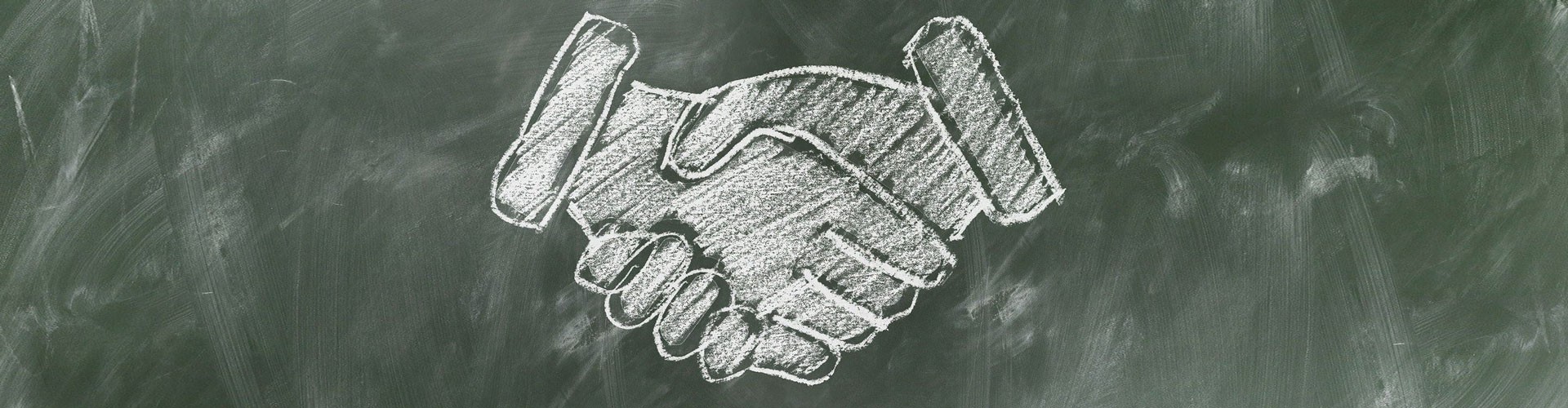 chalk board drawing of shaking hands