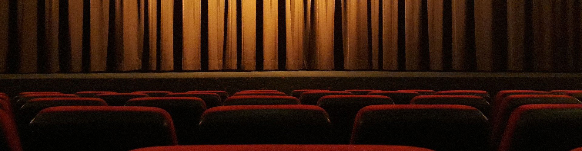 closed theatre curtain in empty theatre
