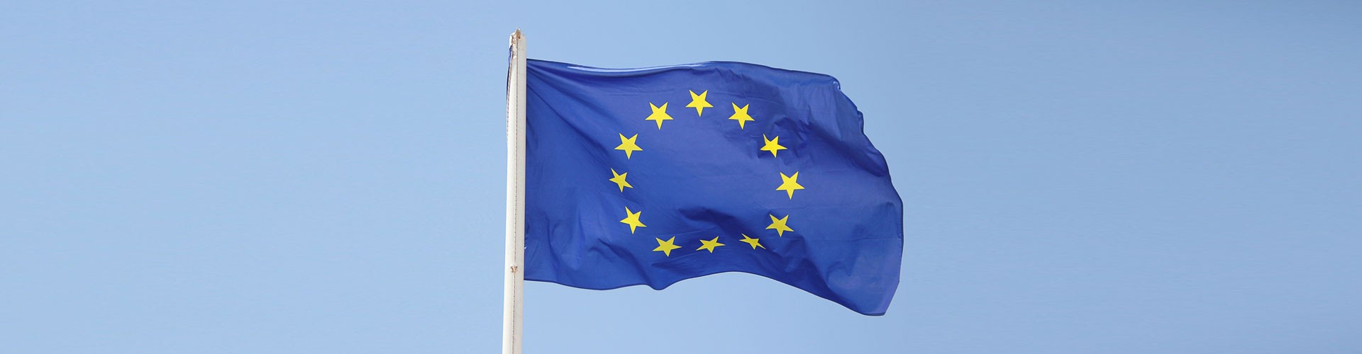 EU flag on blue sky background