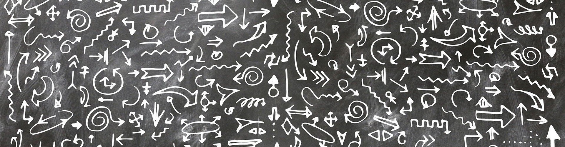 many arrows on a blackboard