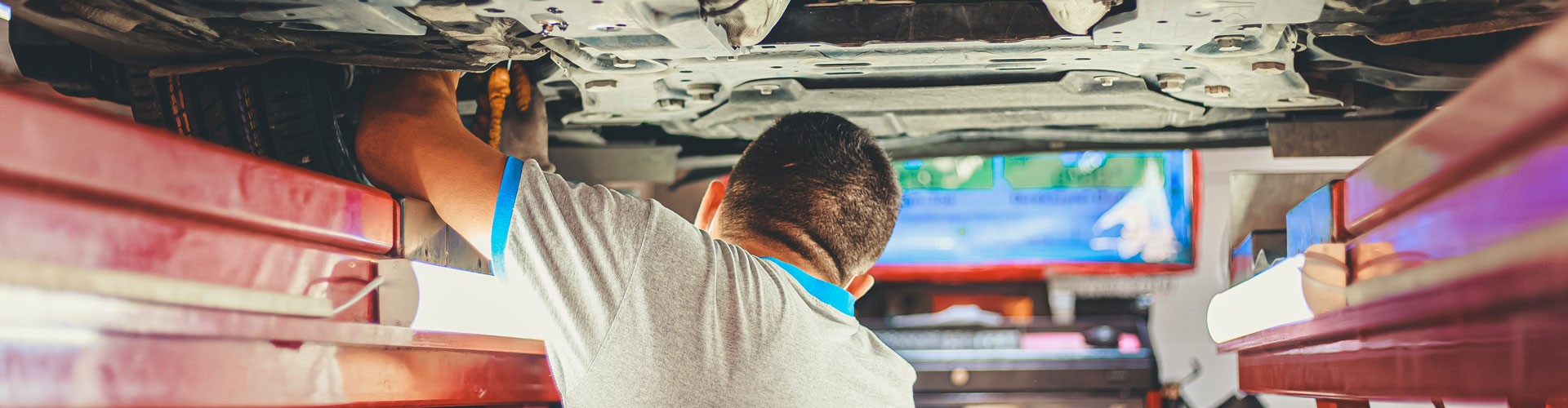 mechanic under a car