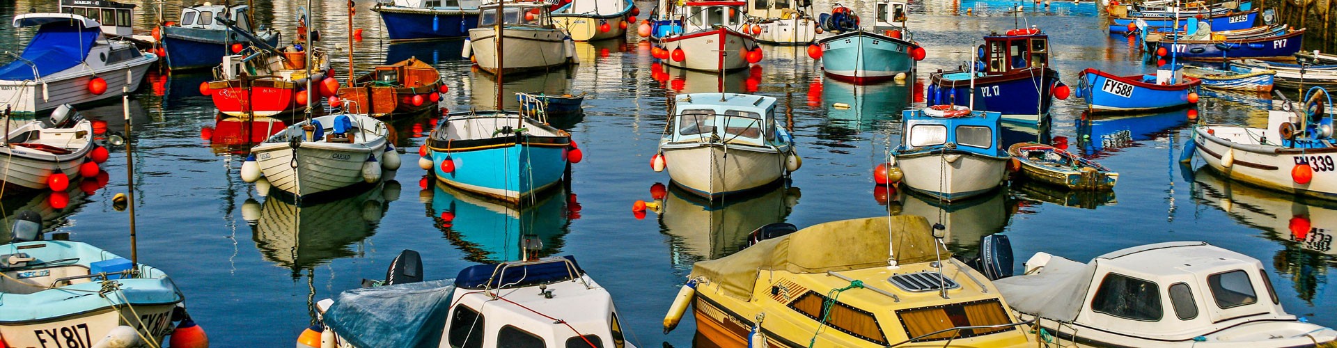 colourful fishing boats in Cornish port