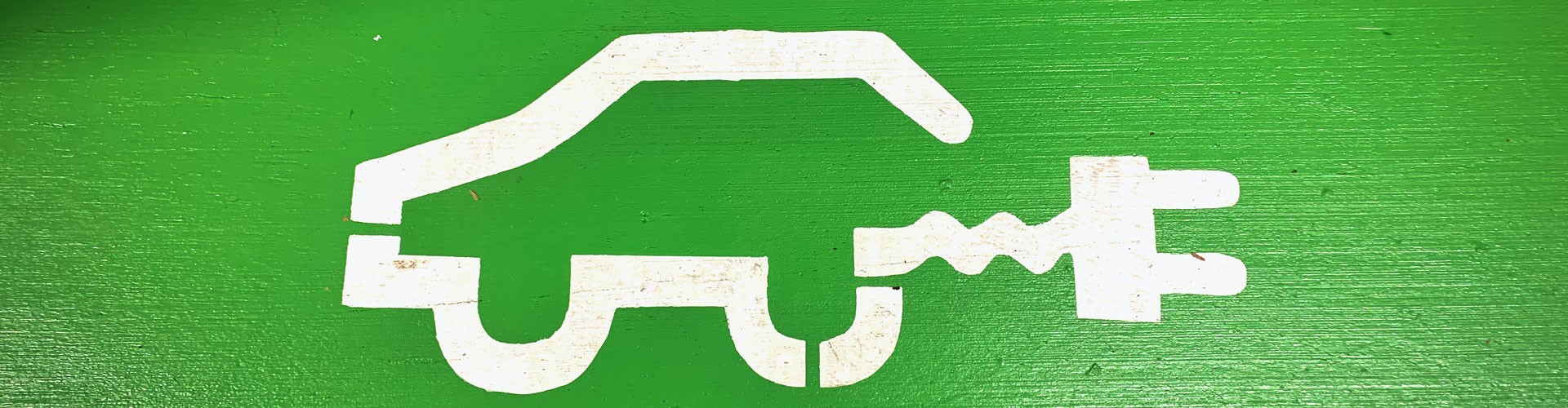 graphic of an electric car on a green background