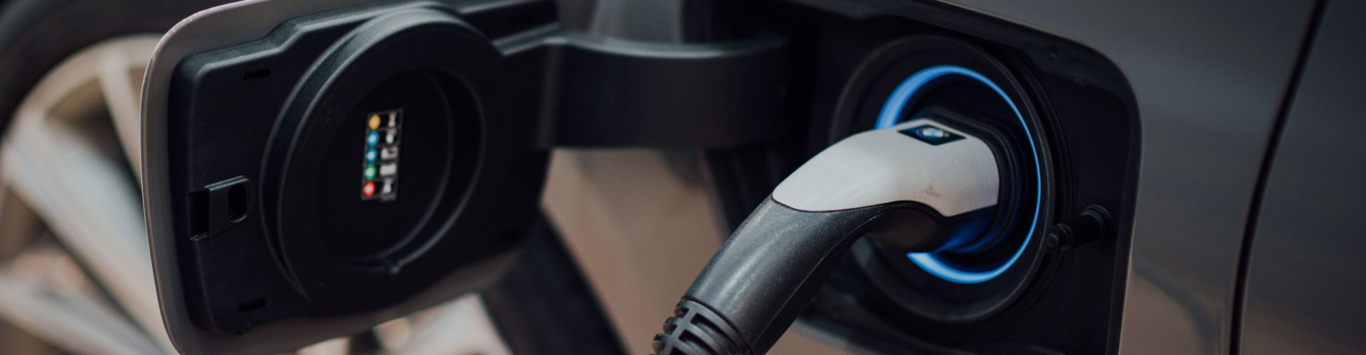 electric car plugged in close up