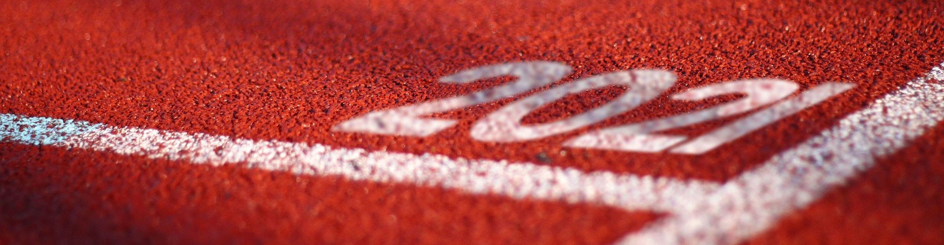 2021 on tarmac at start line of running track
