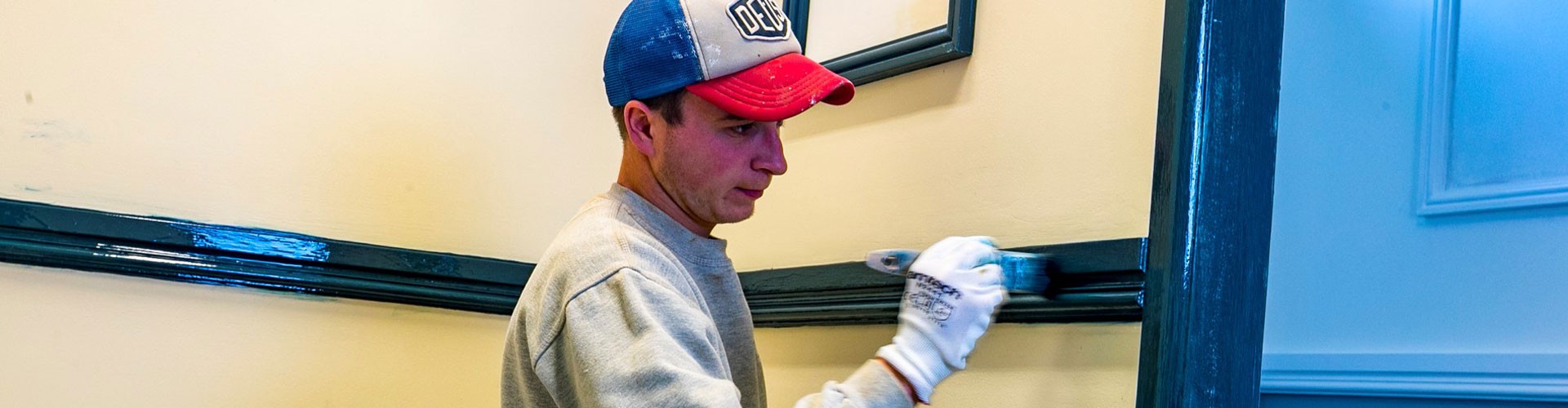 young man painting and decorating