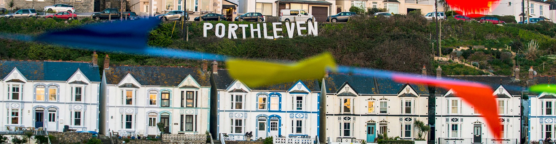 porthleven sign above town at food festival