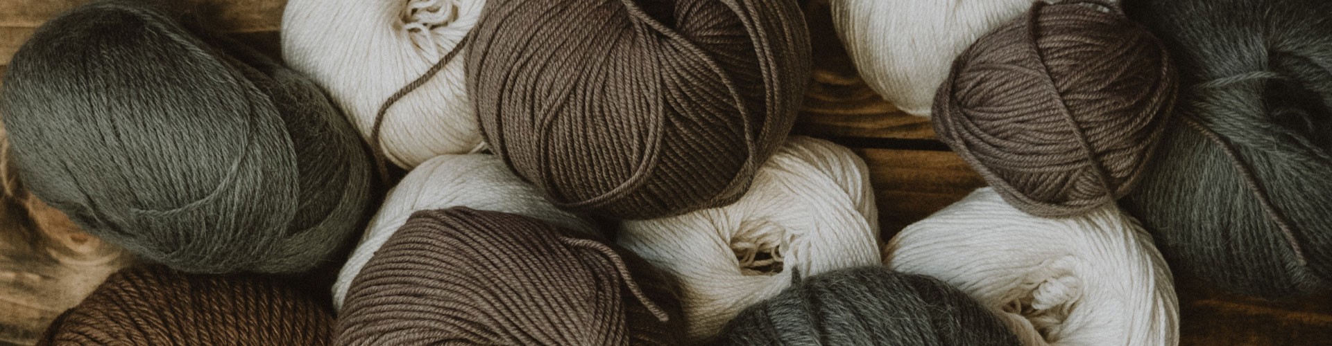 balls of brown and natural coloured wool