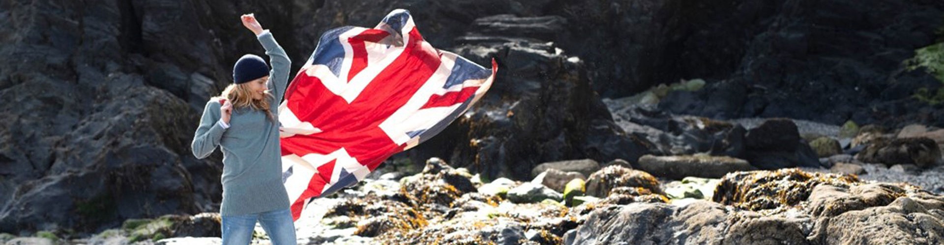 woman on cornish beach with union jack