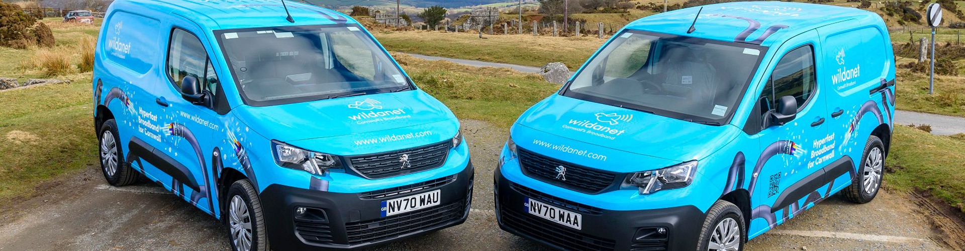 Wildanet company vans with Cornish landscape in the background