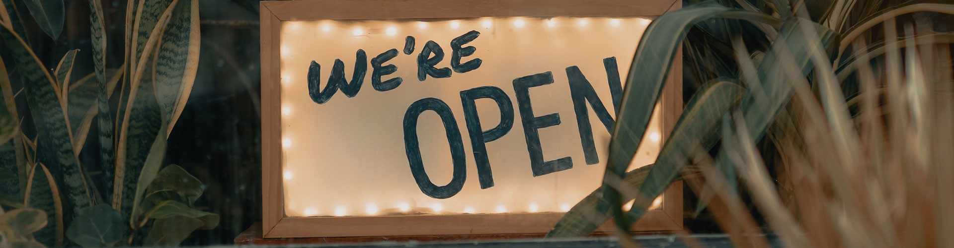 open sign with foliage