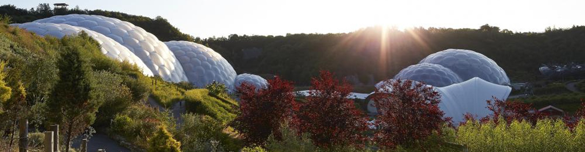 Eden Project biomes with sun shining low in the sky