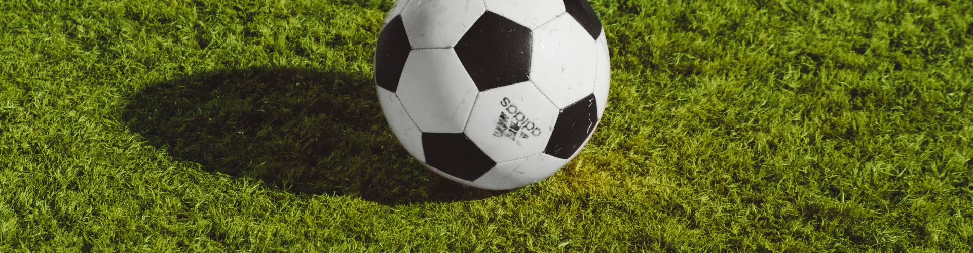 A football on green grass