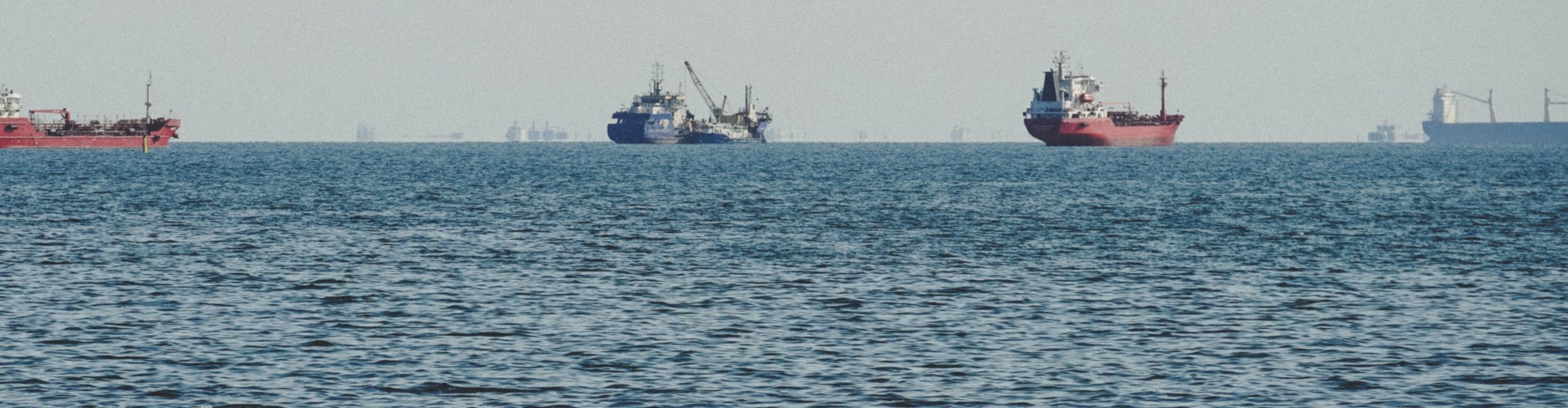 Boats on the ocean's horizon