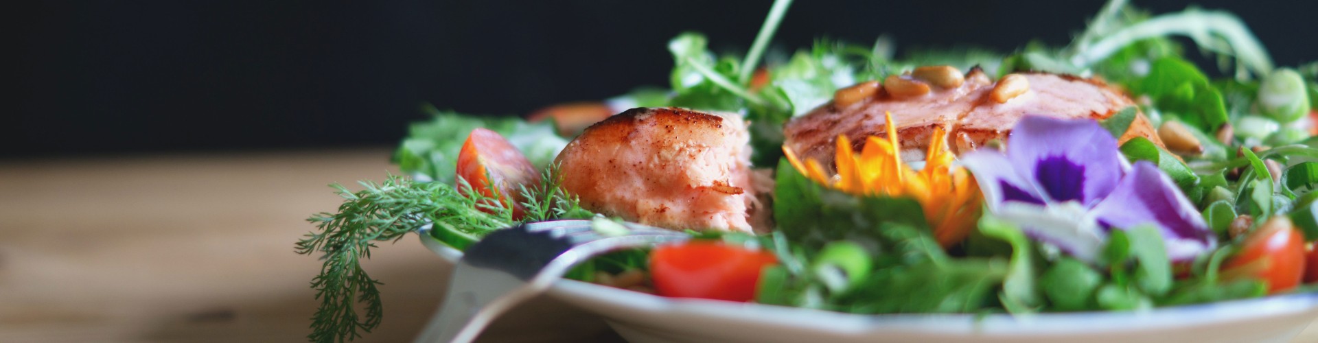 A salad on a plate with a fork
