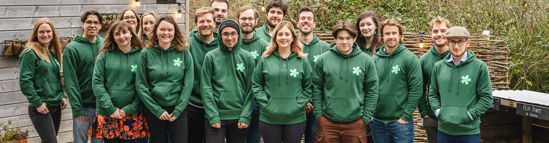 Team group with green jumpers 