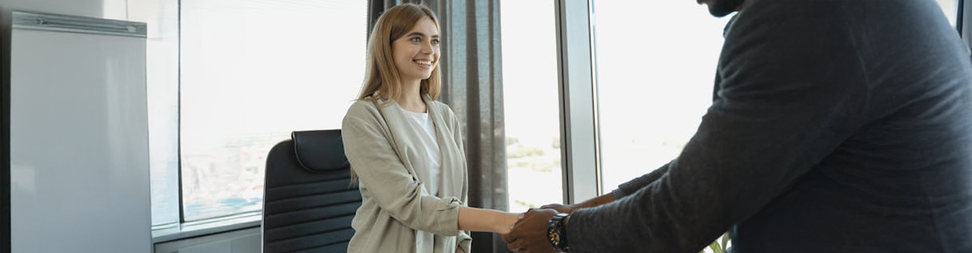 People shaking hands at an interview