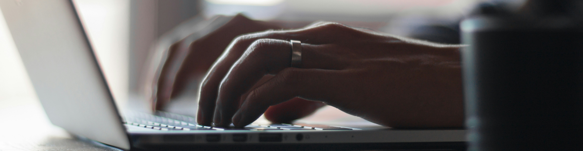 Image of fingers on laptop