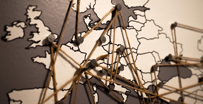 map of Northern Europe with pins and string