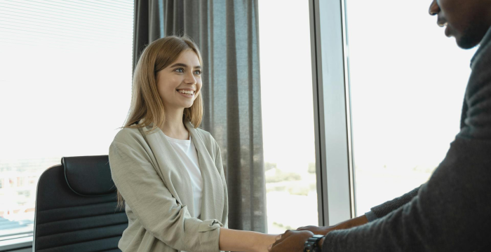People shaking hands at an interview