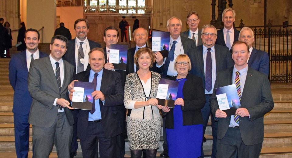 business people and politicians in group posing for camera