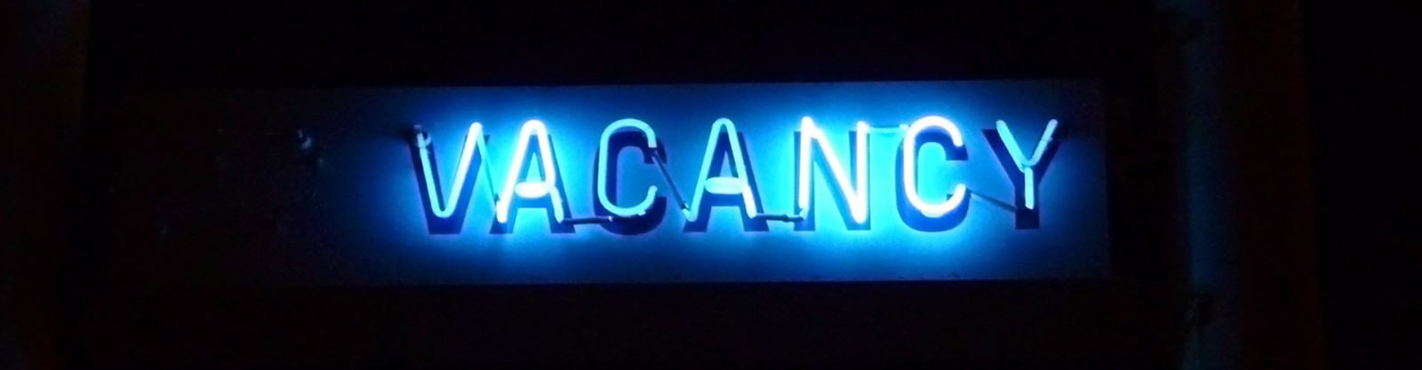 neon blue vacancy sign